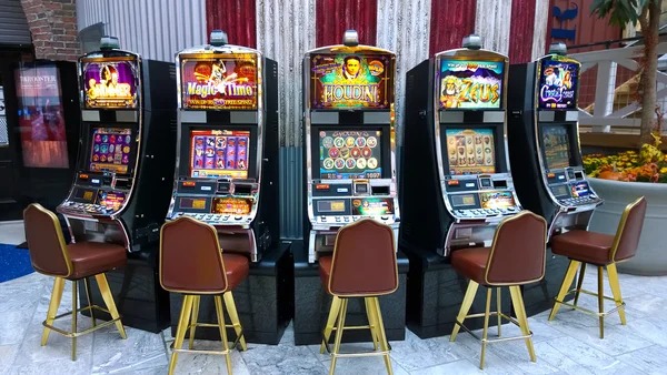 Slot game interface showing reels and spin button on mobile phone